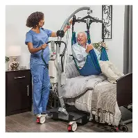 Nurse using a patient lift to safely transfer an elderly patient